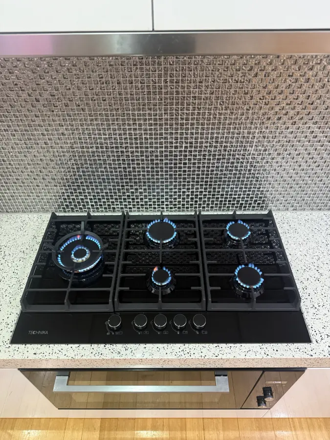 Five-burner gas cooktop installed by A1 Plumbing Co
